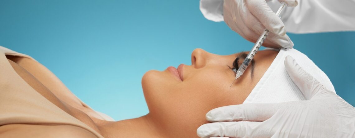Close-up of a provider reviewing a Botox treatment plan and pricing with a patient at a med spa in Jericho, Long Island