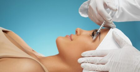 Close-up of a provider reviewing a Botox treatment plan and pricing with a patient at a med spa in Jericho, Long Island