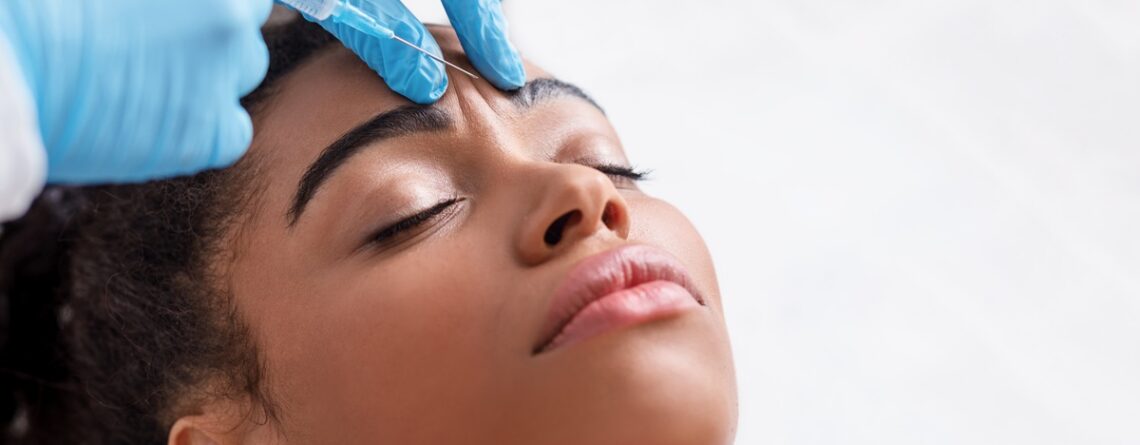 A relaxed woman receiving a Botox injection at a med spa in Jericho, Long Island, with a calm expression during treatment