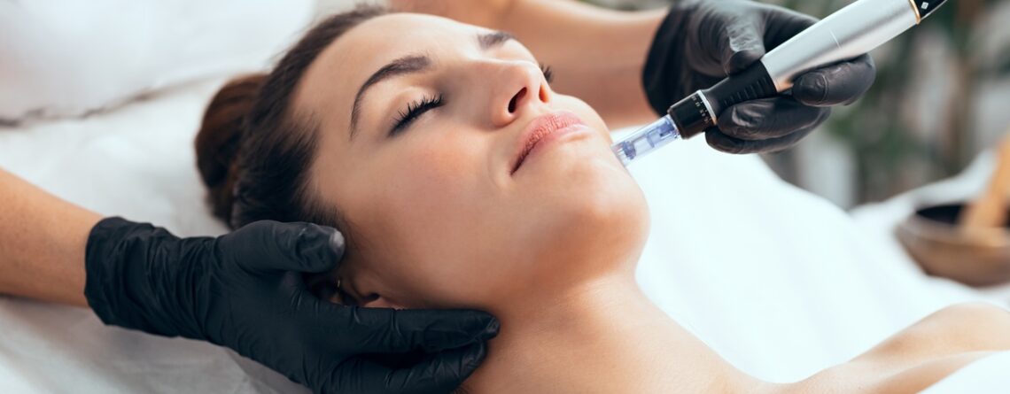 A HydraFacial device being used on a patient at a med spa in Jericho, Long Island, showing the vortex tip on skin